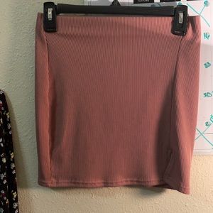 A mini skirt it’s a pastel pink it’s new never put it on and never will